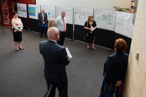 ATO staff showing the Hon Minister Morton MP a display of the MBR program journey